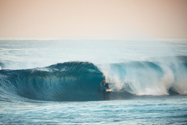 A surfer becomes engulfed by a tunnel wave in Margaret River to show the world class waves found on the south western australia road trip