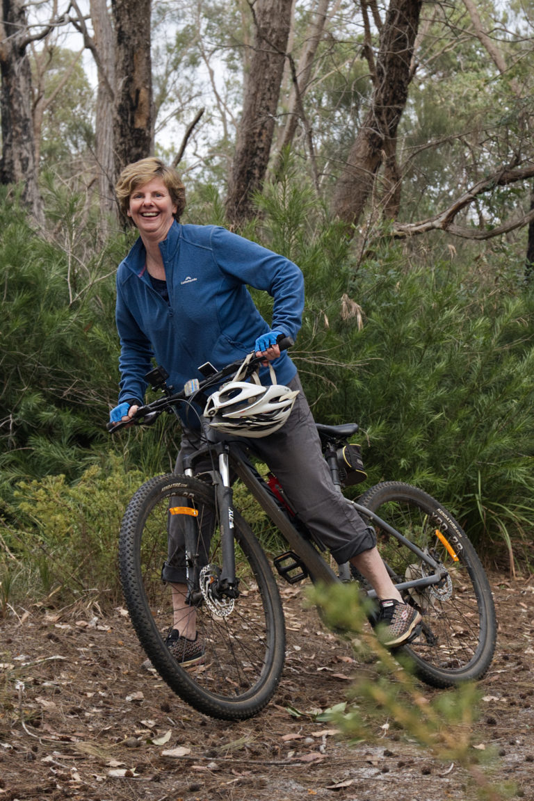 Portrait image of Louise Stokes on a mountain bike to show characters on The South West Edge road trip in Nannup