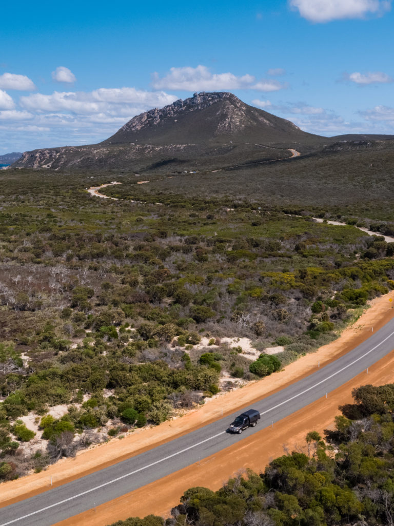 car driving away from mountain in Fitzgerald River National Park