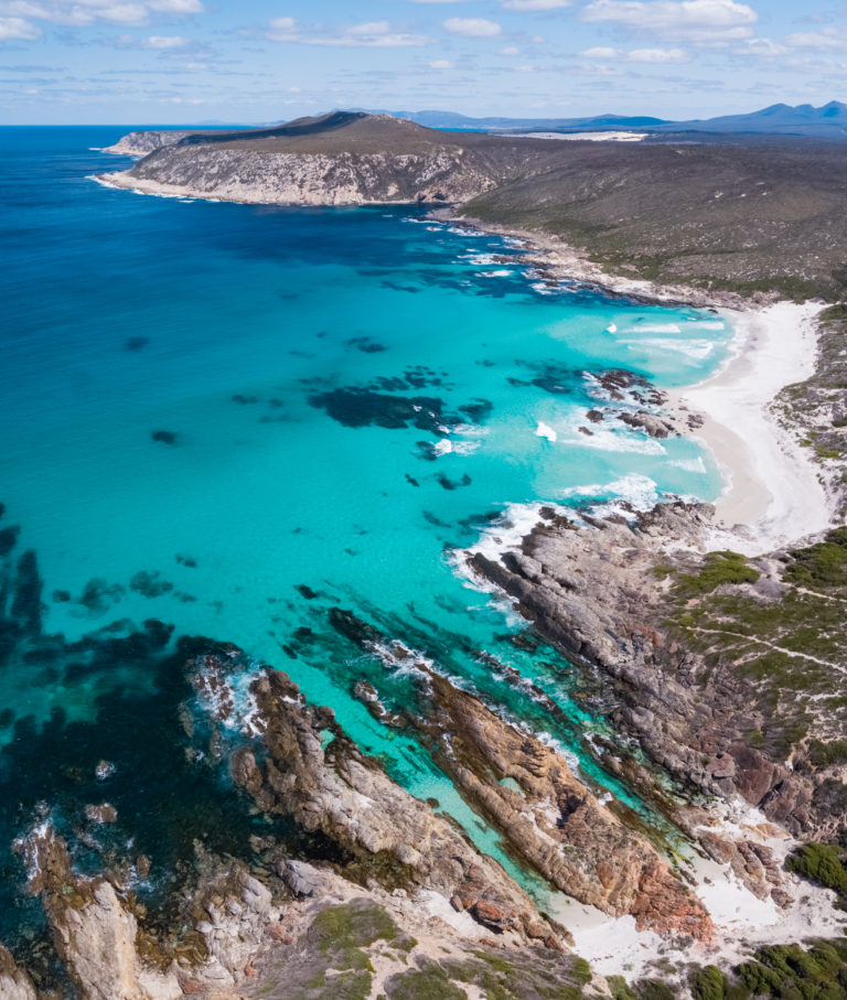 drone portrait image of Fitzgerald River National Park blue ocean, rugged coastline and rock pools to show epic landscapes on The South West Edge