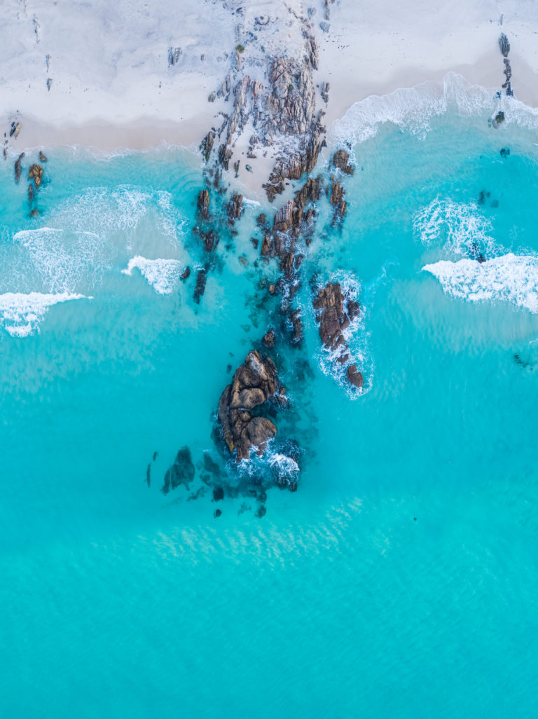 drone image of blue ocean with rocks to show natural landscapes on The South West Edge road trips