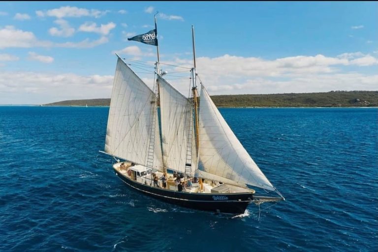 drone image of pearl lugger sail boat Willie Cruises to show tour operator en route along The South West Edge
