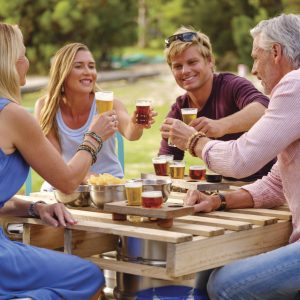 An image of a group of people enjoying beer to show brews and views and food and drink experiences on The South West Edge road trip